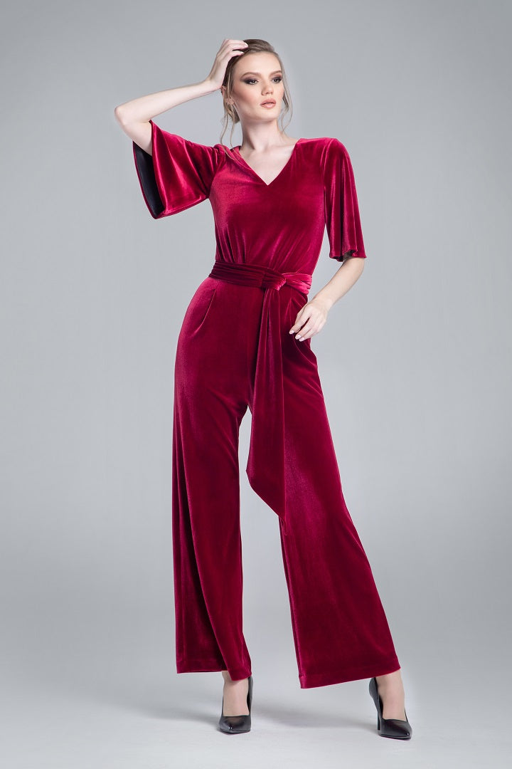 Velvet jumpsuit with bell sleeves and sash in burgundy