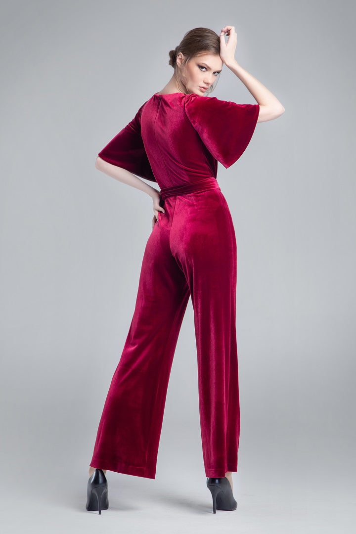 Velvet jumpsuit with bell sleeves and sash in burgundy