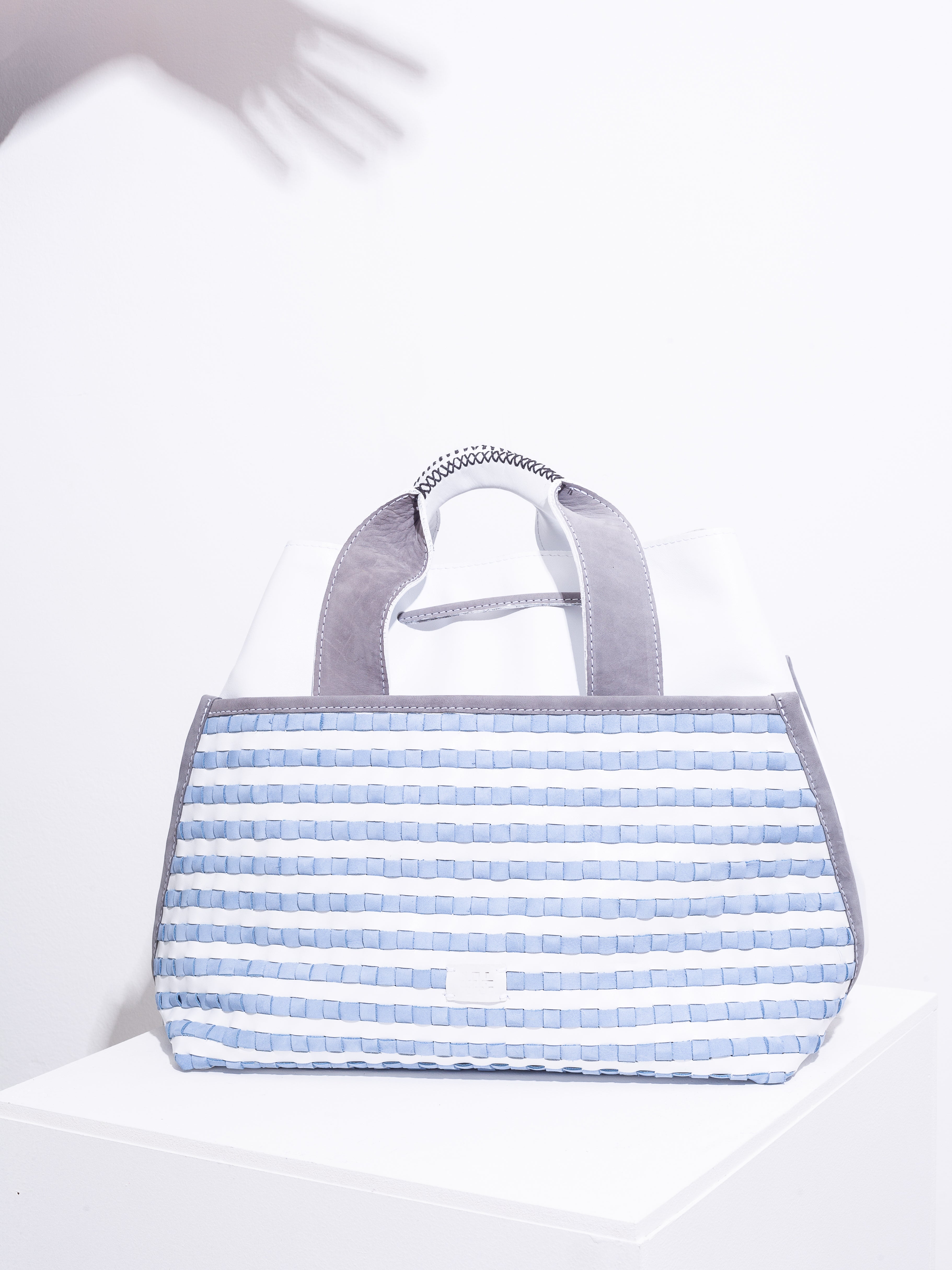 White and sky blue suede weave tote