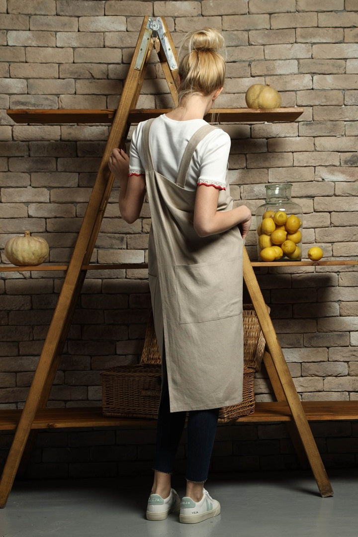 Overlapping cross-back linen apron in sand