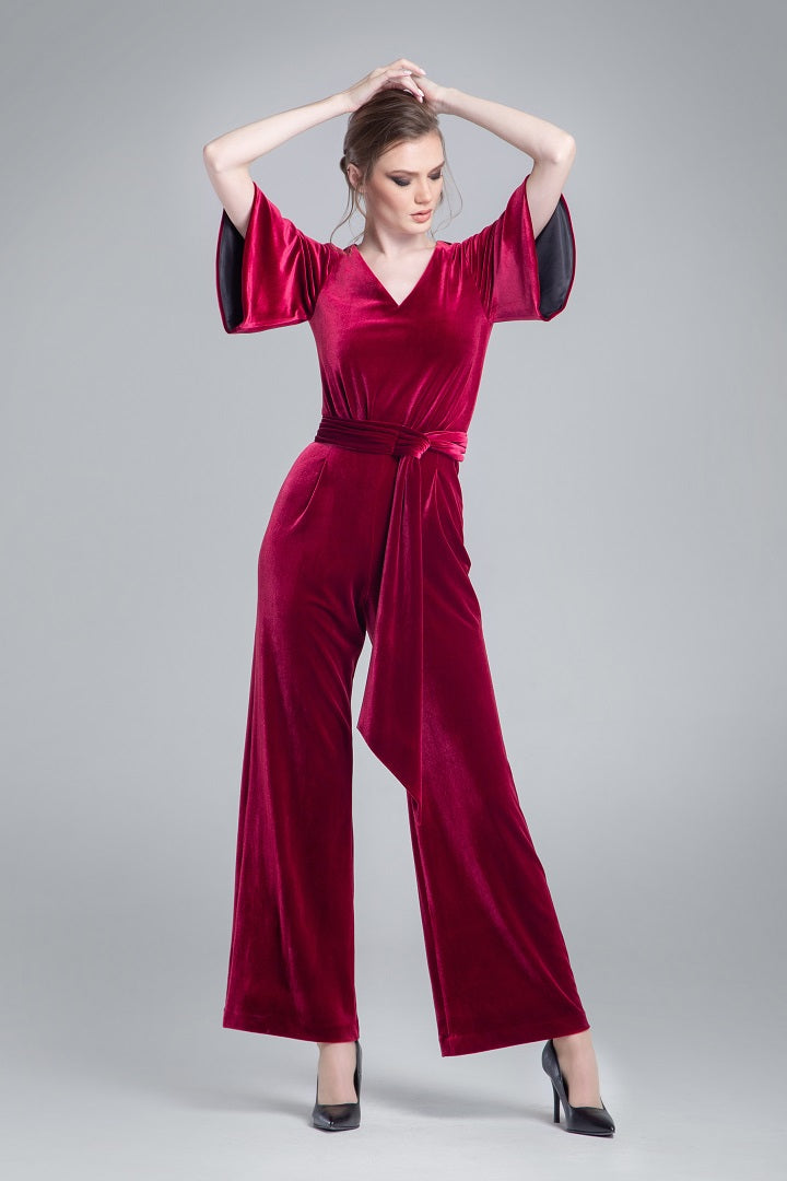 Velvet jumpsuit with bell sleeves and sash in burgundy