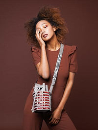 Mini circular bucket bag in grey with striped vino mirror effect