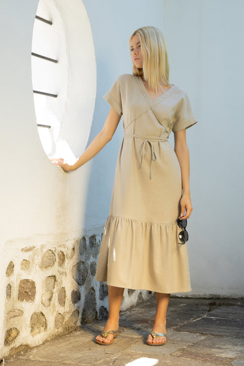 Mykonos linen midi dress with a low tiered hem and a tie-around belt