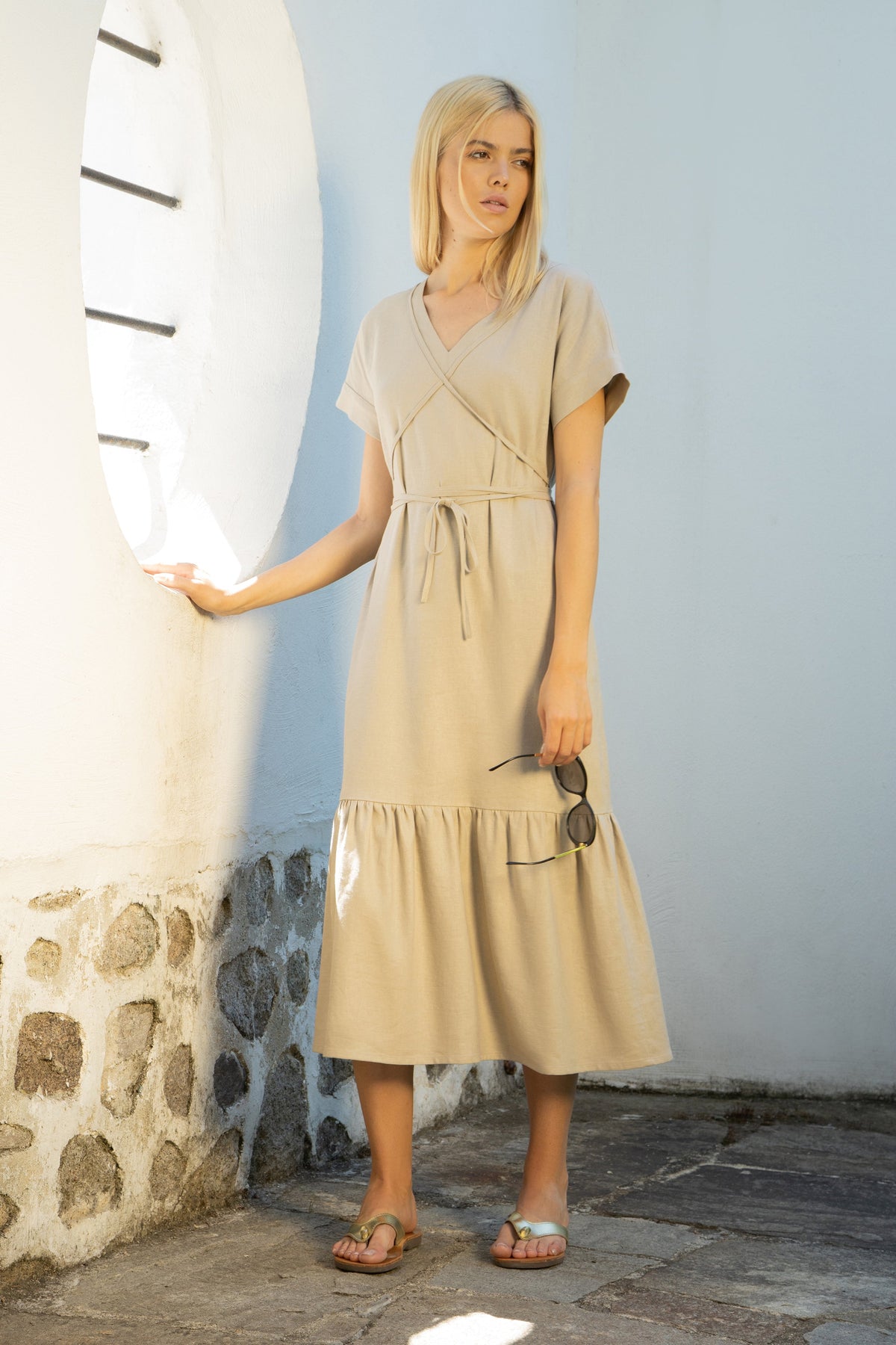 Mykonos linen midi dress with a low tiered hem and a tie-around belt