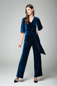 Velvet jumpsuit with bell sleeves and sash in royal blue