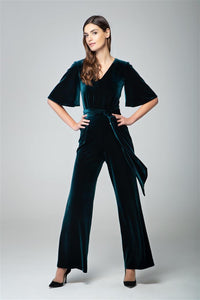 Velvet jumpsuit with bell sleeves and sash in emerald green